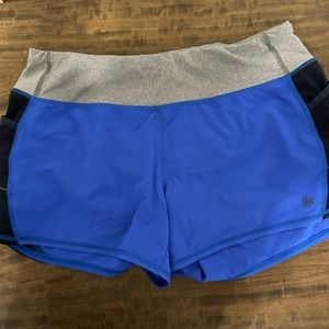 Athleta running short with pockets 4” inseam wide waist band medium EUC